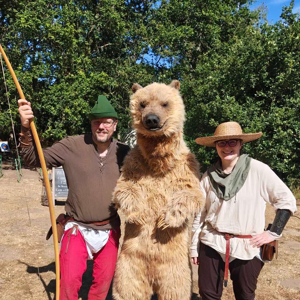 Realistic grizzly bear costume walking through Sherwood Forest